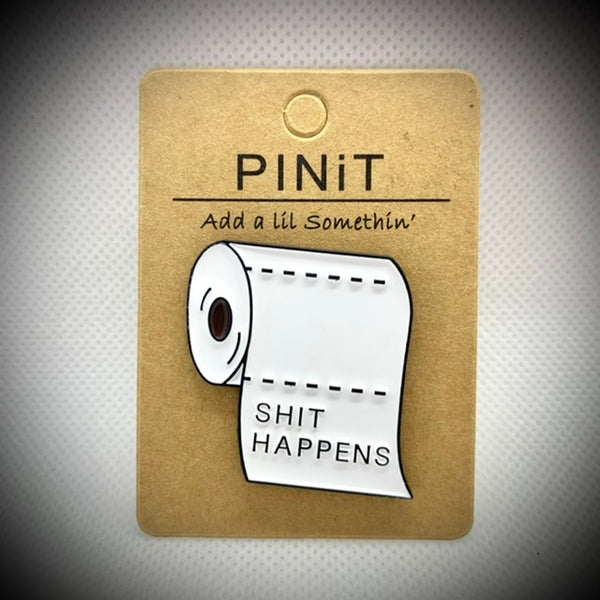 PINiT pin saying shit happens, a toilet paper roll, add a lil somethin’